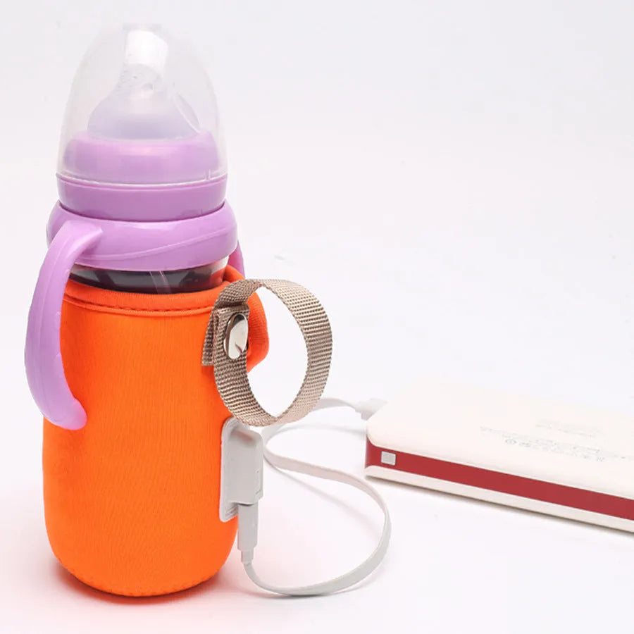 USB heated baby bottle warmer sleeve in blue, wrapped around a milk bottle showing its cotton and PC construction.