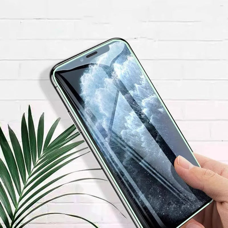 Luminous full cover tempered glass screen protector glowing in the dark for iPhone.