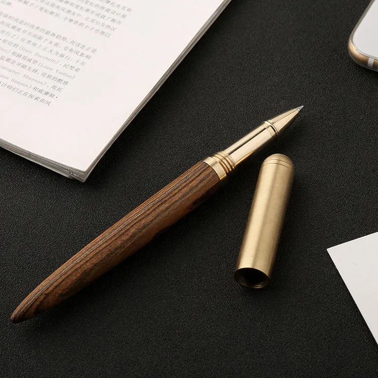 Brass and sandalwood signature pen showing wood grain and metal details at 14cm length