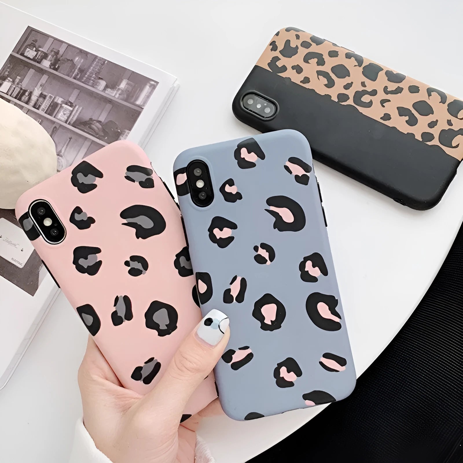 Leopard print iPhone case showing animal pattern design on black background