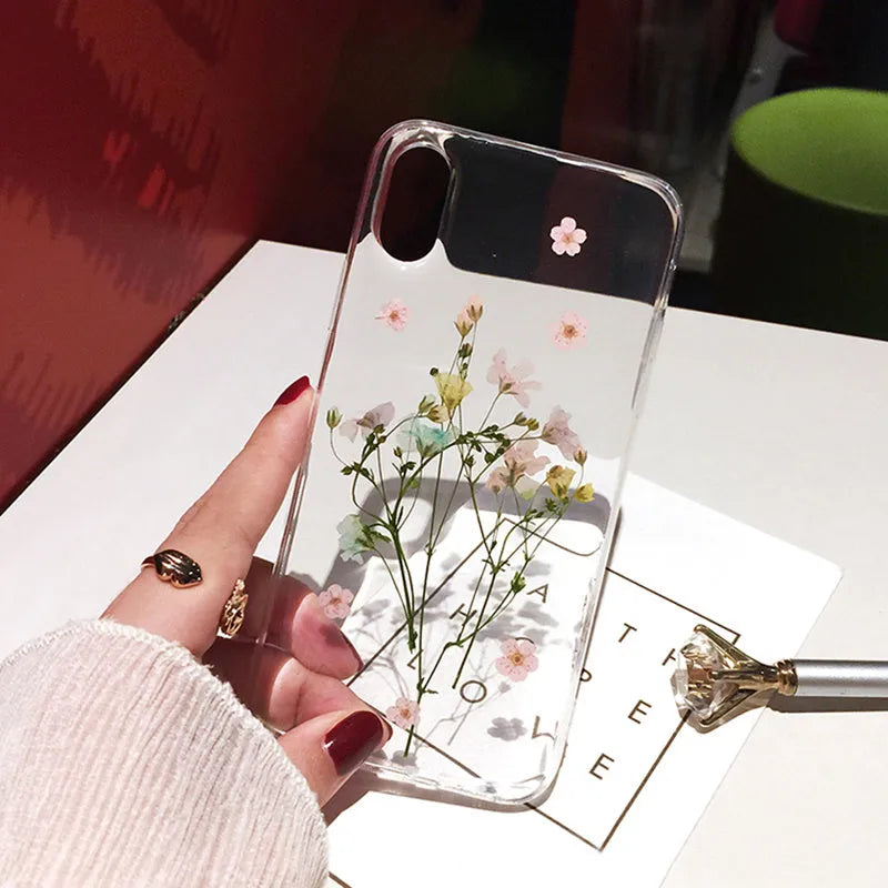 Handmade clear iPhone case with preserved dried flowers in epoxy resin sealing
