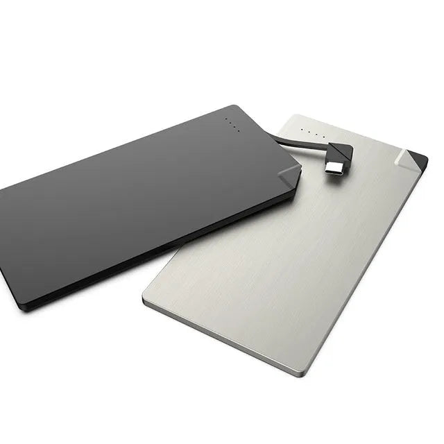 Silver aluminium graphene power bank showing slim 4mm profile with Lightning and Micro-USB ports