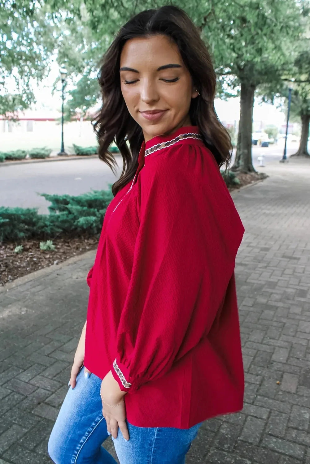 Women's red loose fit polyester pullover shirt with embroidered collar and printed detail