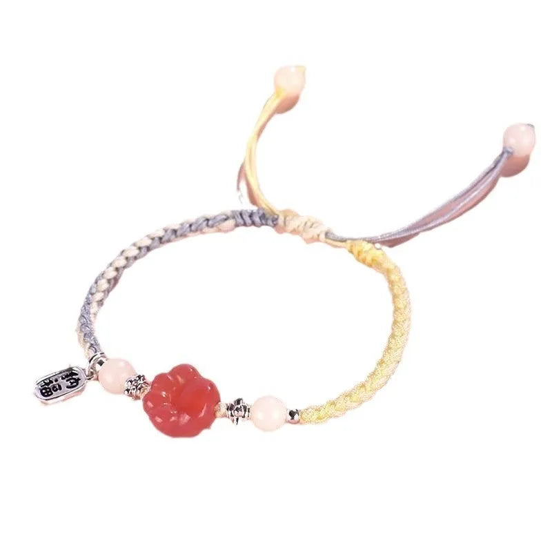 Handmade red cat's paw charm bracelet woven with pink or yellow glass beads in a pastoral couple's style.