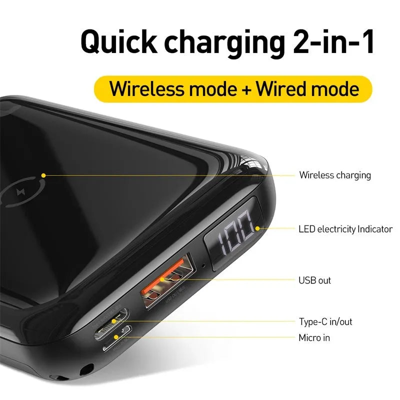 Small square black portable power bank with LED digital display on a table.