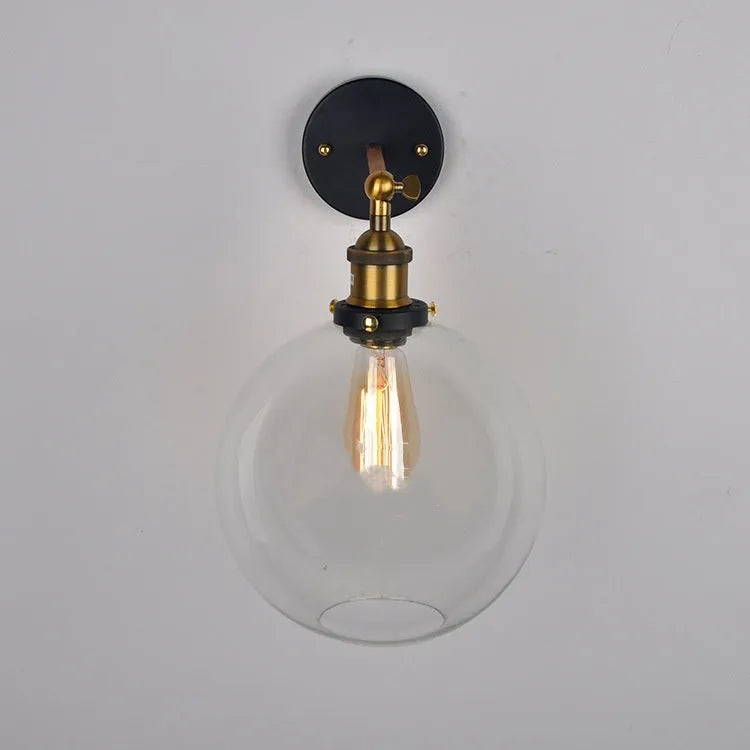 Retro-style 20cm round ball glass wall lamp with aluminium holder in amber, smoke grey, or transparent.