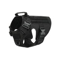 Military tactical dog harness in khaki with adjustable straps, pockets, and metal connection points on a German Shepherd