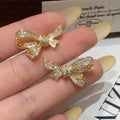 Gold or silver bowknot earrings with copper base, electroplating, 925 silver needle, and zircon inlay