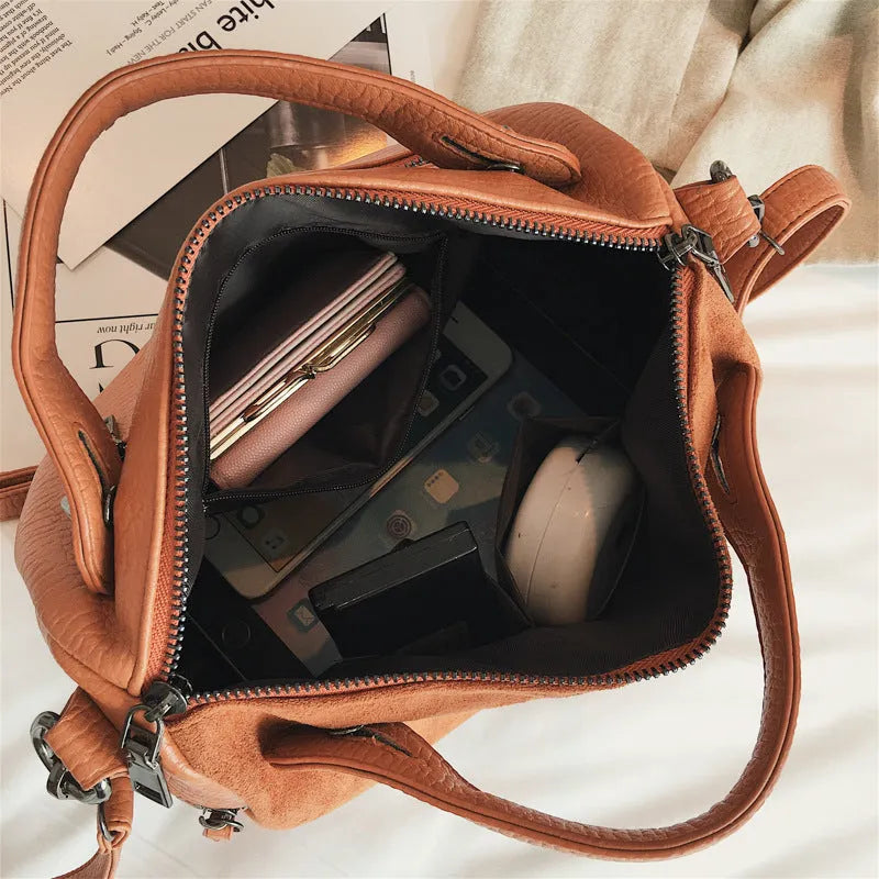 Soft PU leather casual tote shoulder bag for women in black, showing large capacity and zip closure.