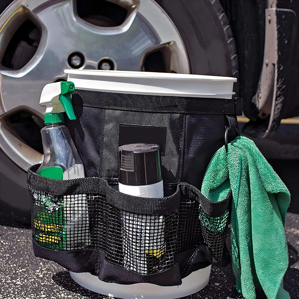 Black cylindrical polyester storage bag hanging on 5 gallon bucket for tool organisation