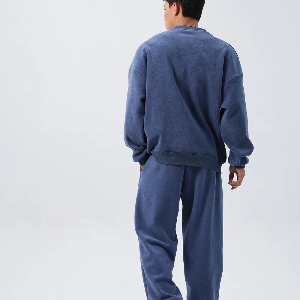 Men's polar fleece winter sports suit two-piece set showing padded jacket and matching trousers