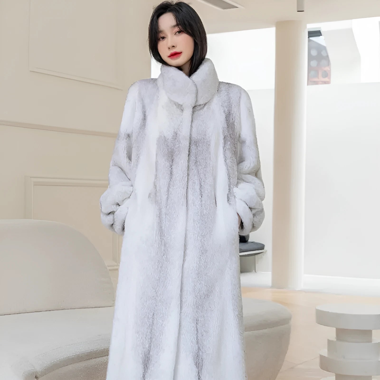 White faux fur coat with a stand-up collar and regular sleeves on a female model.