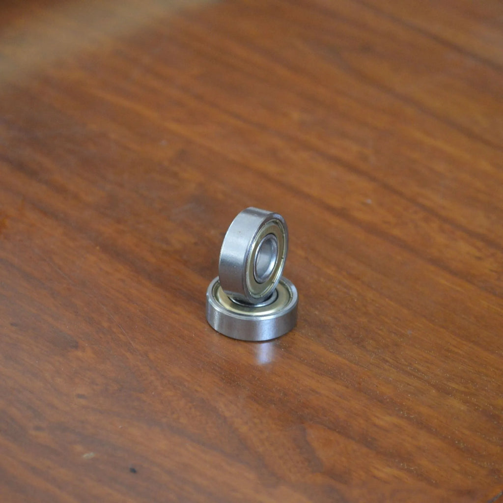 6000z carbon steel ball bearing with 10mm inner diameter, 26mm outer diameter, and 8mm width on a white background.