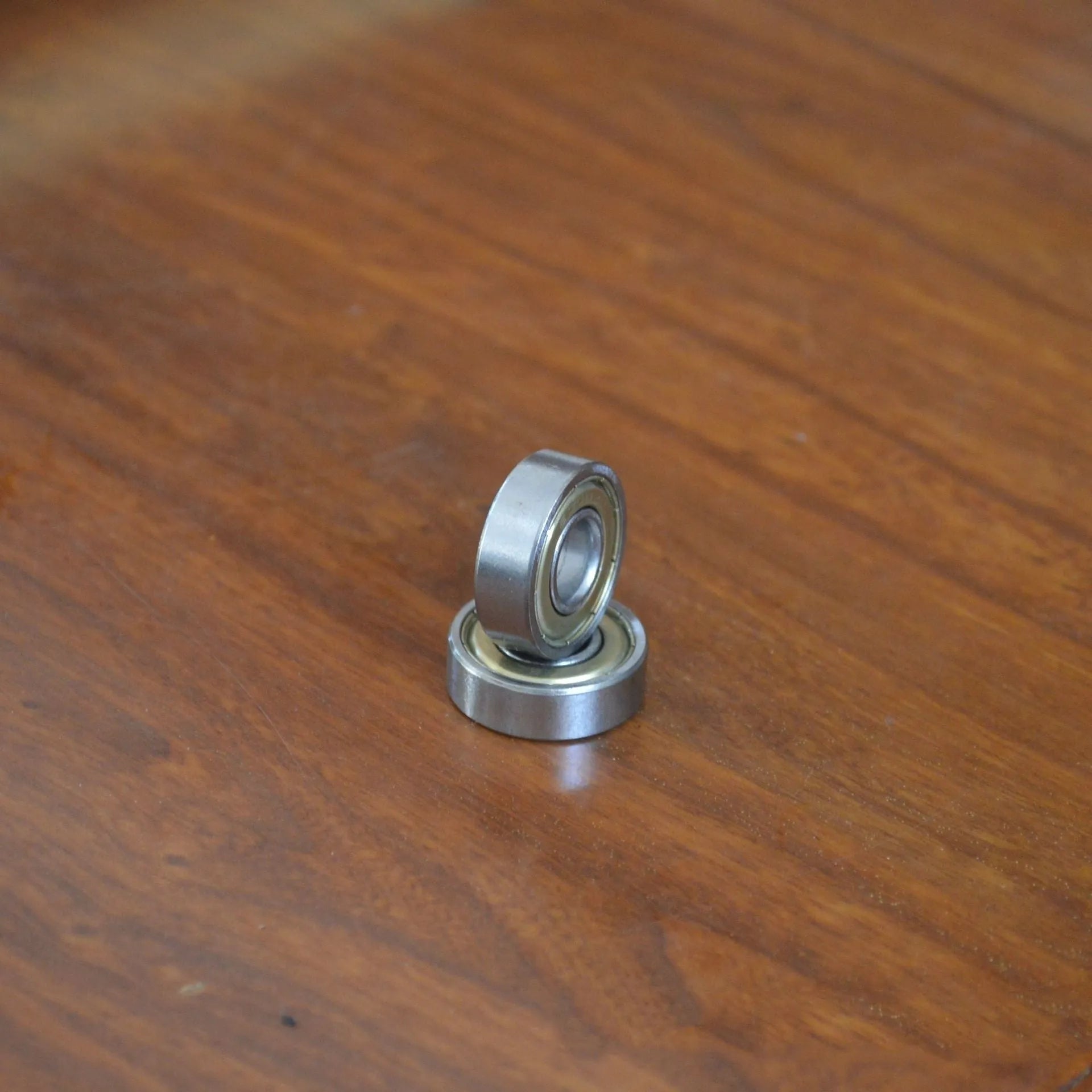 6000z carbon steel ball bearing with 10mm inner diameter, 26mm outer diameter, and 8mm width on a white background.