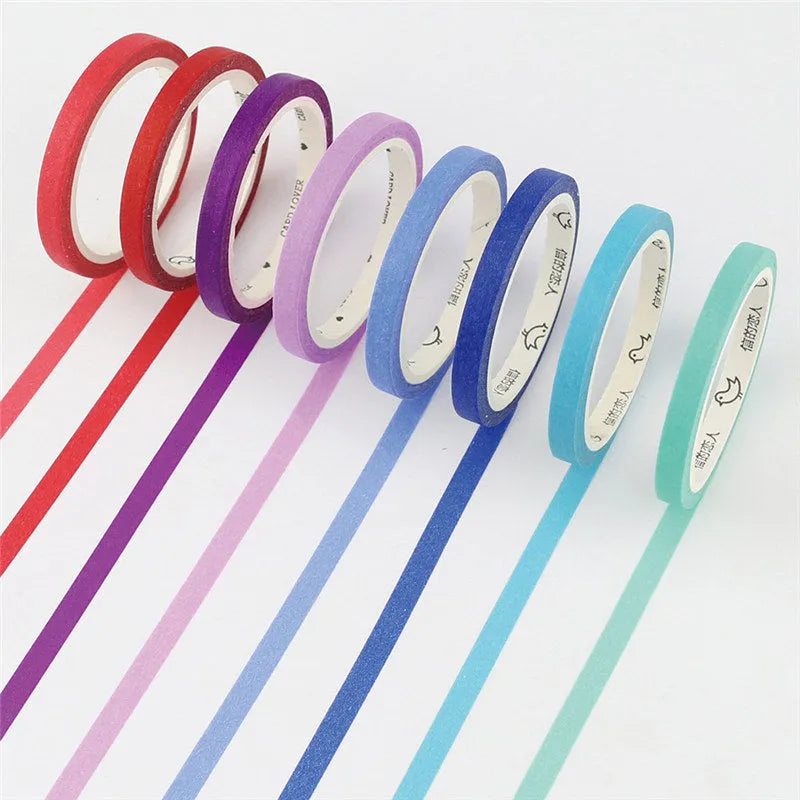 Hand-roll of solid colour paper tape in crimson and deep purple, showing narrow 5mm width.