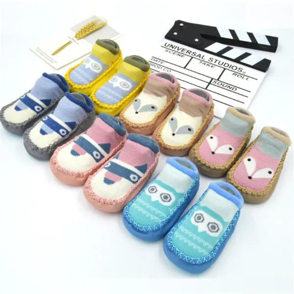 Baby floor socks with anti-slip sole in combed cotton fabric, showing colour and pattern options