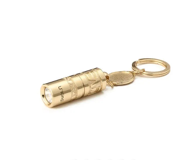 Gold zinc alloy waterproof LED flashlight attached to a keyring.