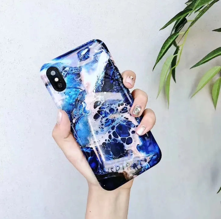 Colourful stone pattern soft protective case for iPhone on a table.
