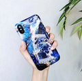 Colourful stone pattern soft protective case for iPhone on a table.