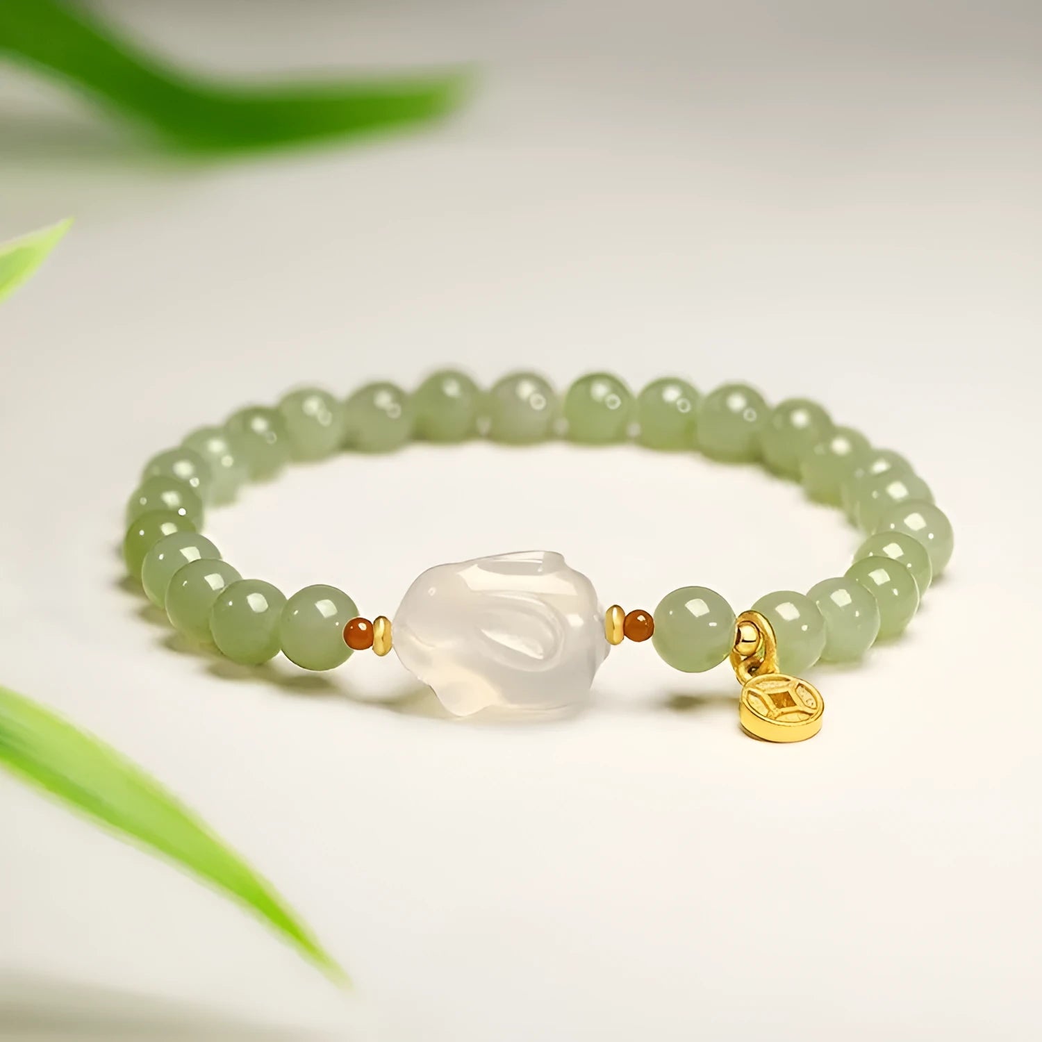 Handmade glass rabbit charm bracelet for women with coloured glaze details