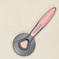 Pet floating hair combing brush in engineering plastic, 193 x 77 x 49 mm, mint green colour, ergonomic handle.