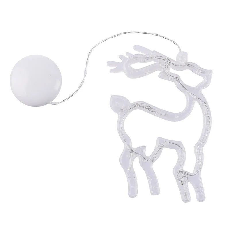 Battery powered LED decorative light with suction cups showing Santa Claus and snowman designs on a window.