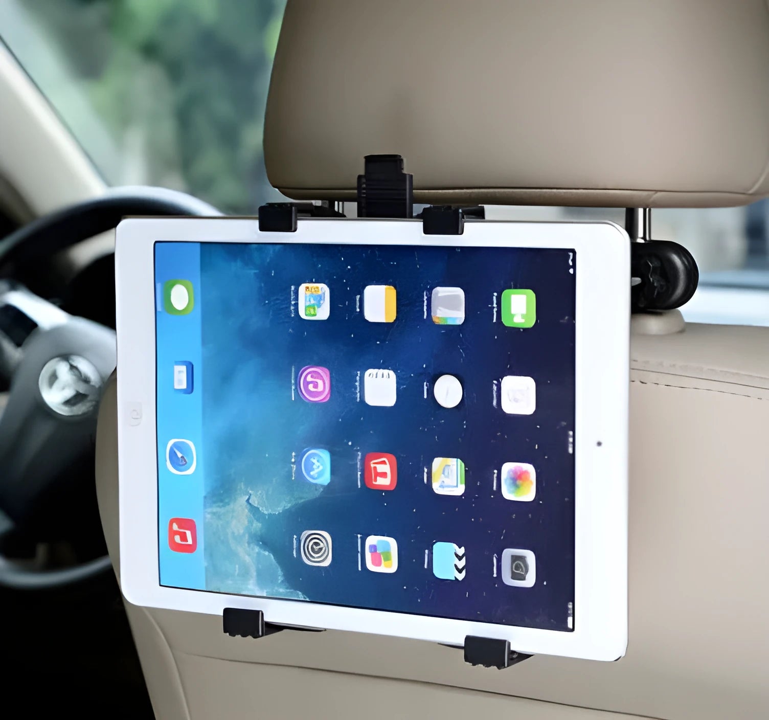 Black car seat tablet holder mounted on headrest with iPad