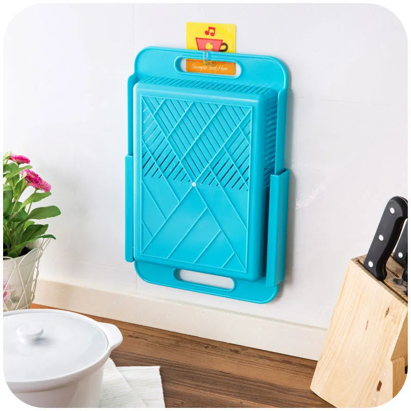 Blue multifunction kitchen chopping board with integrated plastic sink drain basket for vegetable preparation