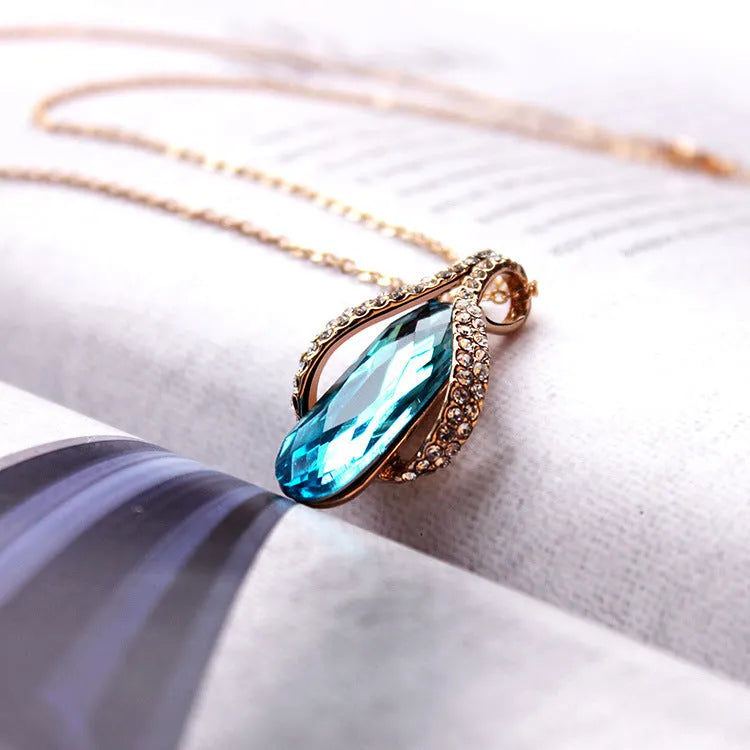 Gold-plated peacock blue earrings and pendant set for women, alloy jewellery with electroplated finish