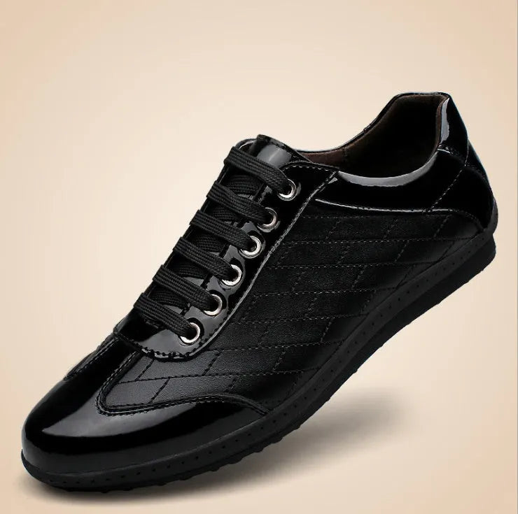 Genuine leather casual men's shoes in black with lace-up closure on a plain background