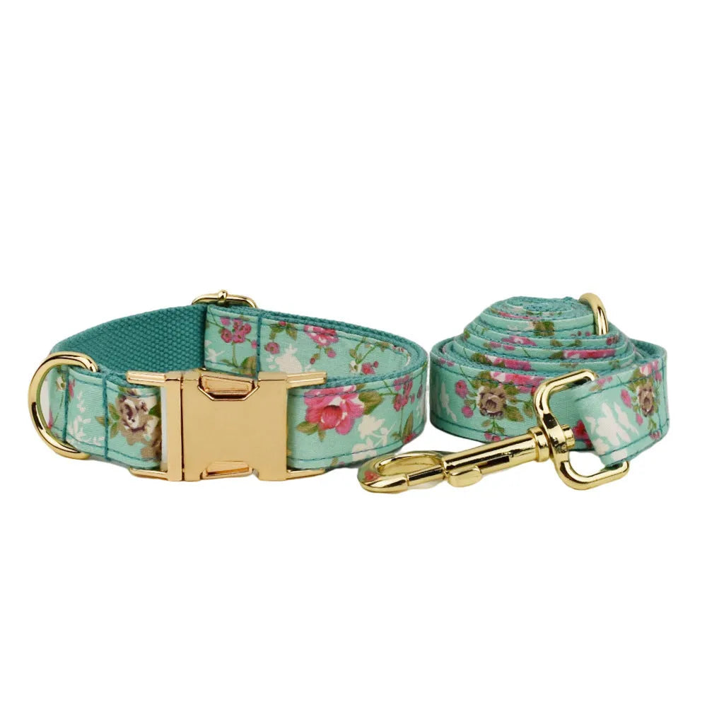Fabric dog collar set with detachable green rose pattern bow, matching leash and vest