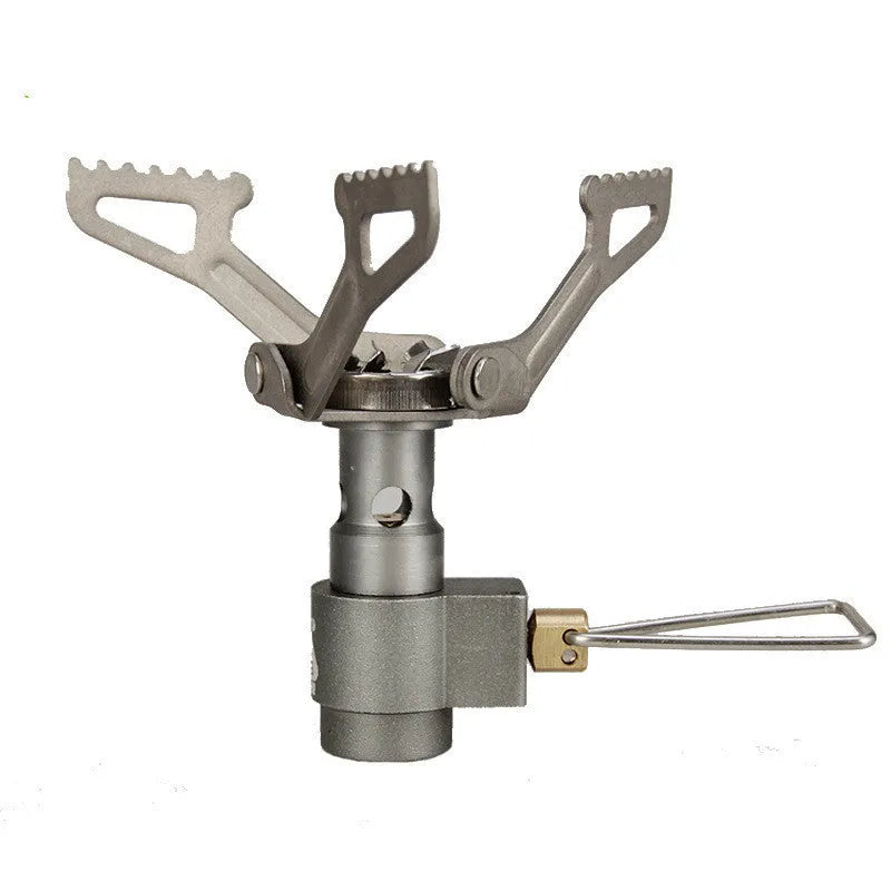 Compact silver portable camping stove with a one-piece burner, using a small green propane gas canister.