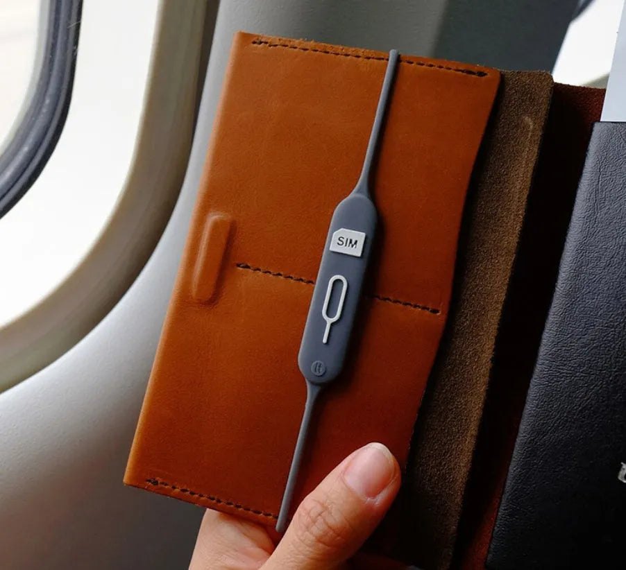 Open-top silicone card holder in green grey colour showing the internal card slot.
