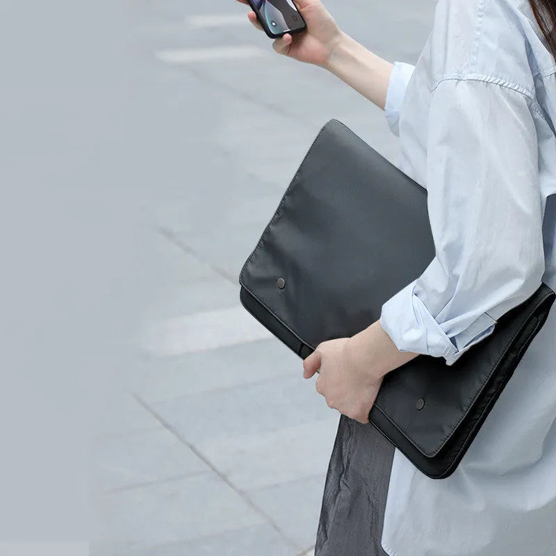 Black and white nylon laptop bag protective cover with flip opening, interior pockets, sizes 13 to 16 inch