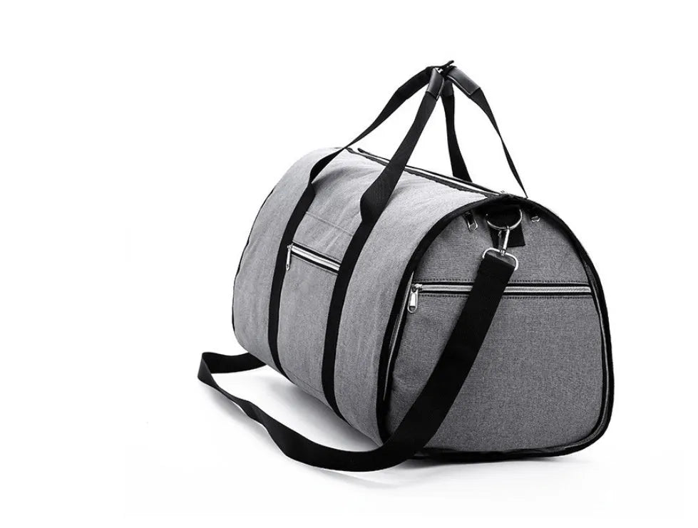 Medium sized cylinder travel bag in black Oxford cloth, showing zipper opening and internal pocket.