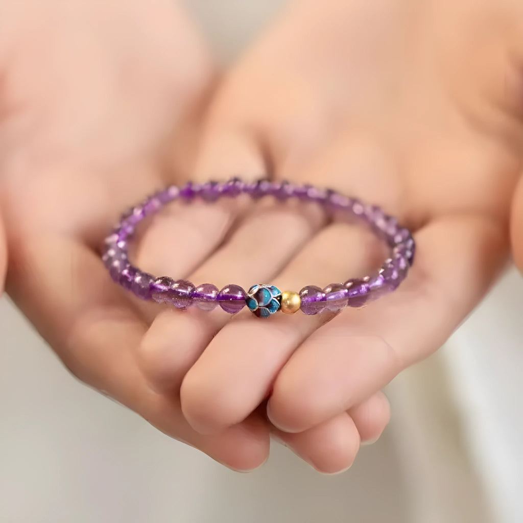 Retro mixed material bracelet with a detailed nine purple lotus design.