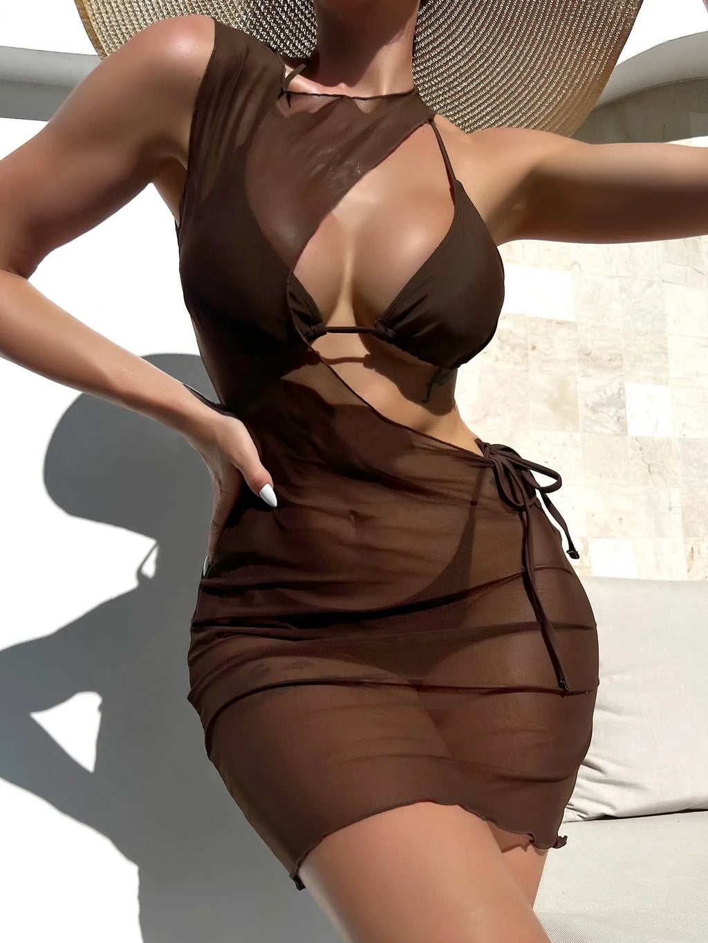 Brown solid colour women's three-piece bikini set with bra, shorts, and blouse on a neutral background.