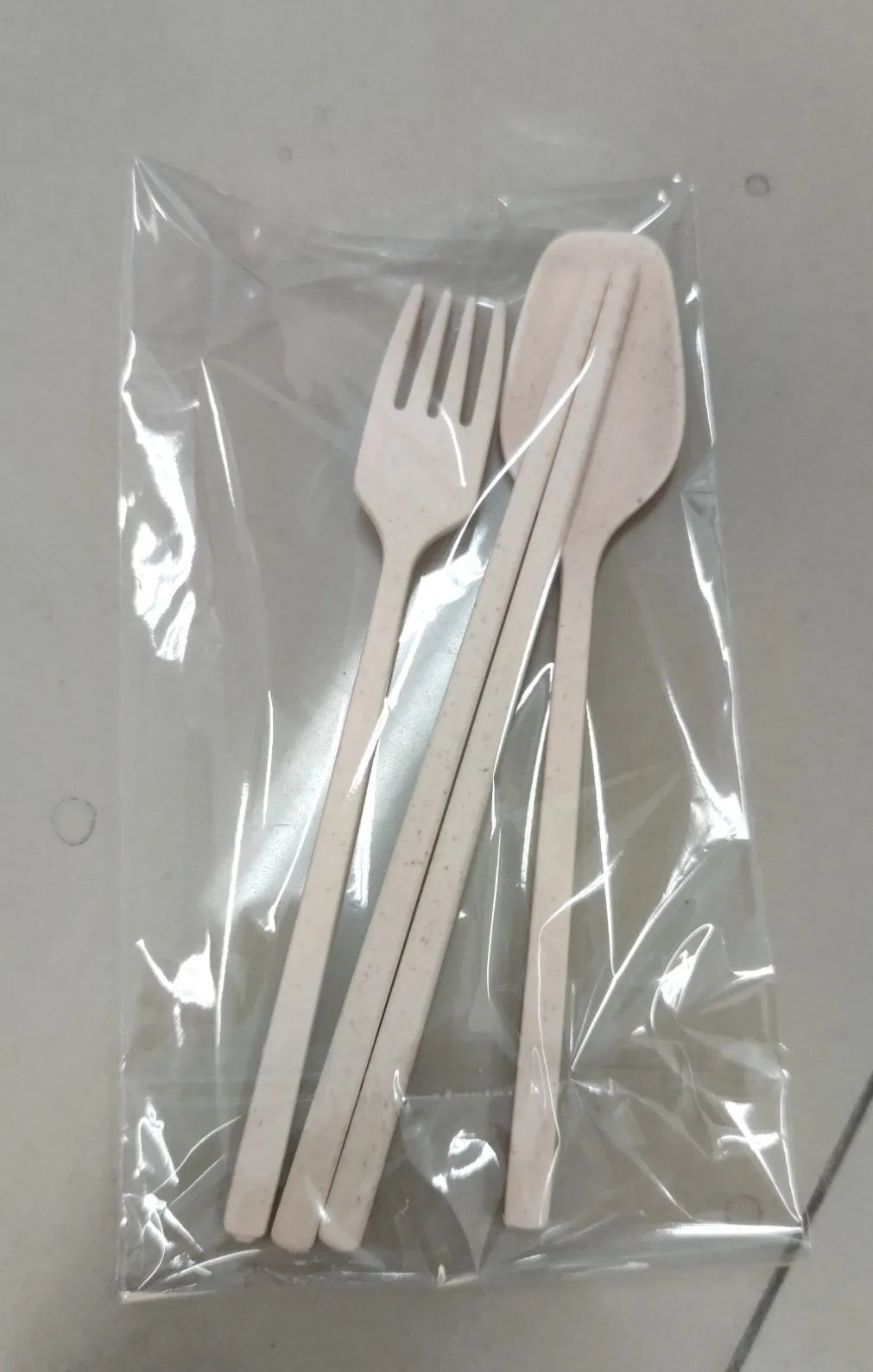Children's wheat straw bowl set featuring Mickey cartoon design with chopsticks, fork, and spoon in beige
