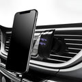 Matte black car phone holder clipped to vehicle air vent holding smartphone