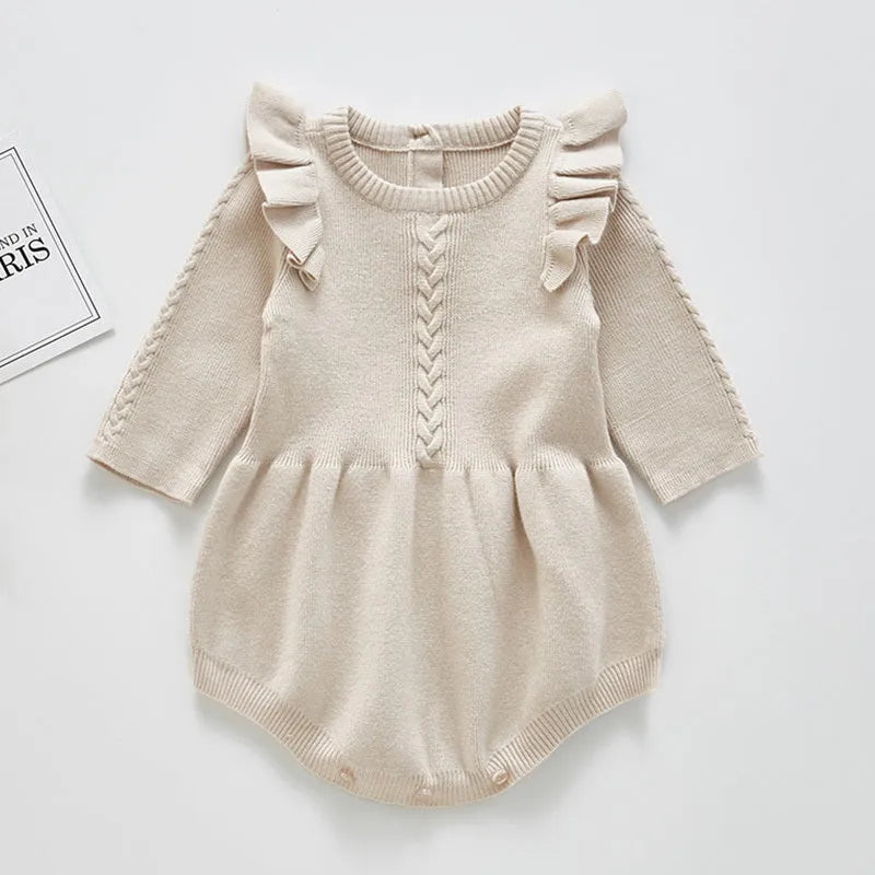 Baby girl's pink cotton princess romper with placket closure