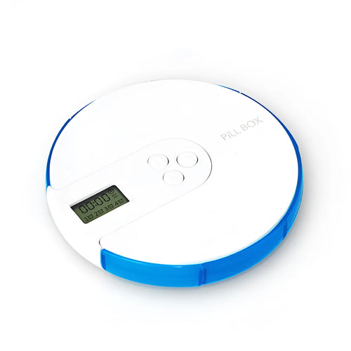 Blue weekly pill organiser with seven compartments, a digital clock display, and clear lids on a wooden table.
