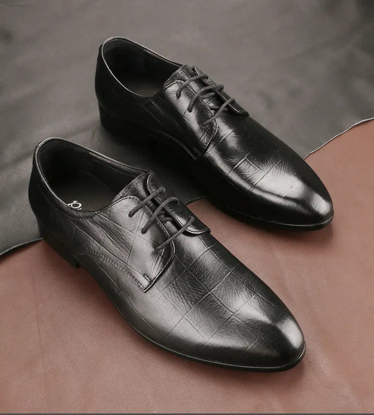 Men's black checkered leather derby shoes with a pointed toe and rubber sole.