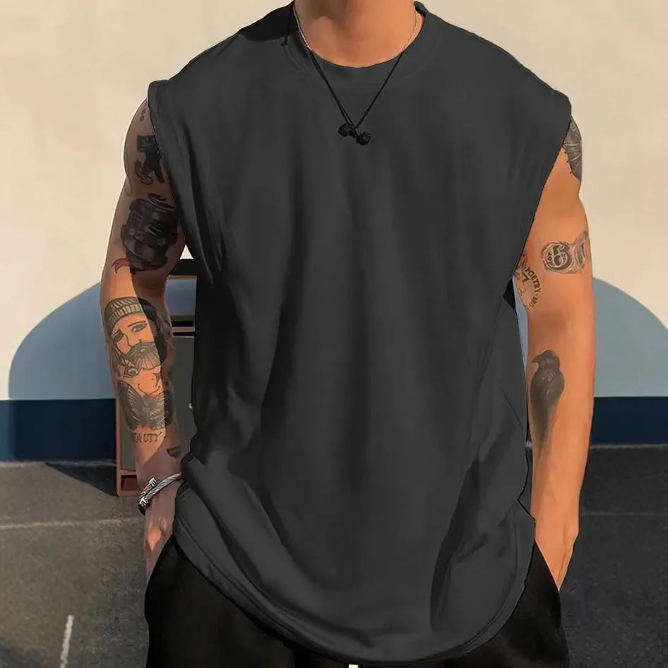 Men's loose solid colour cotton sleeveless tank top on a hanger, showing straight hem design.