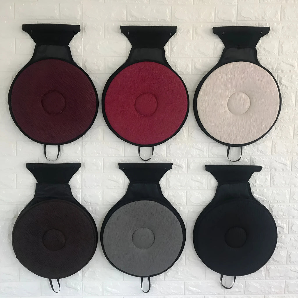 360-degree rotation cushion made of pleated cloth and EVA foam, available in multiple colours, on a chair