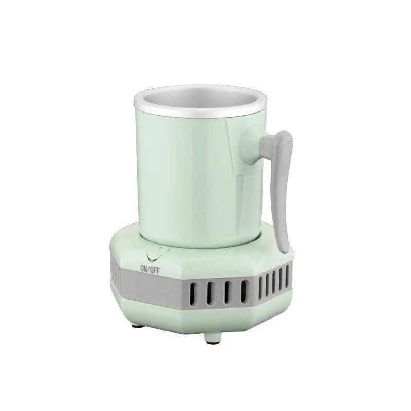 White portable mini cooling cup with aluminium drinking vessel and control base on a desk.