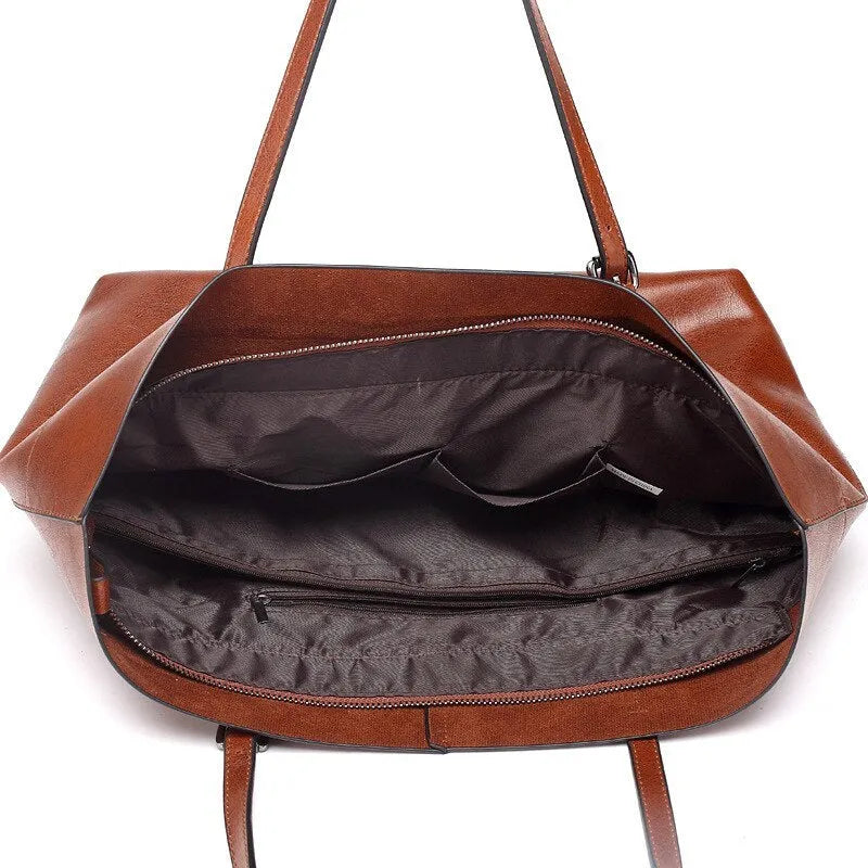 Brown waxed cowhide cross-body leather handbag showing front view with strap, measuring 30cm wide by 37cm tall.