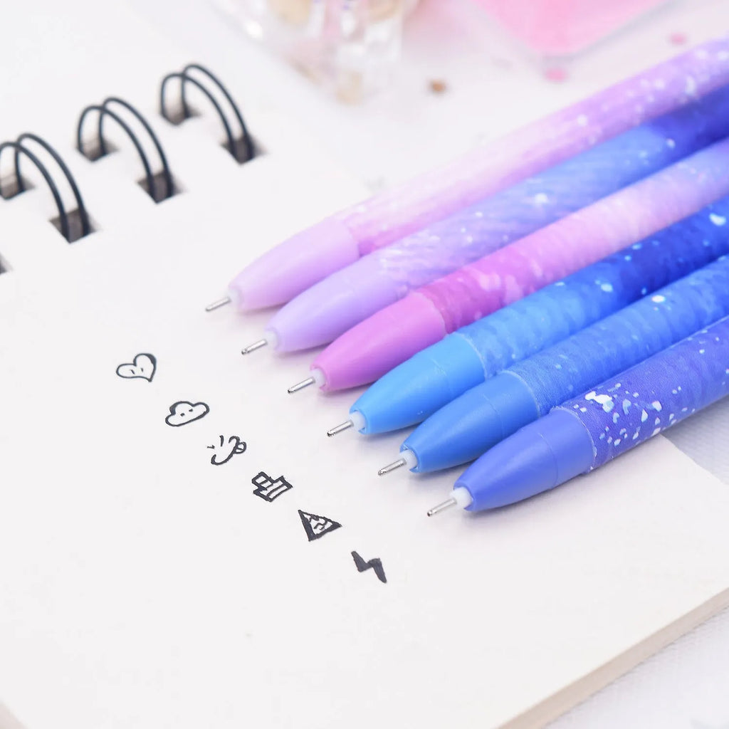 Box containing 12 identical black quick-dry gel pens with constellation branding.
