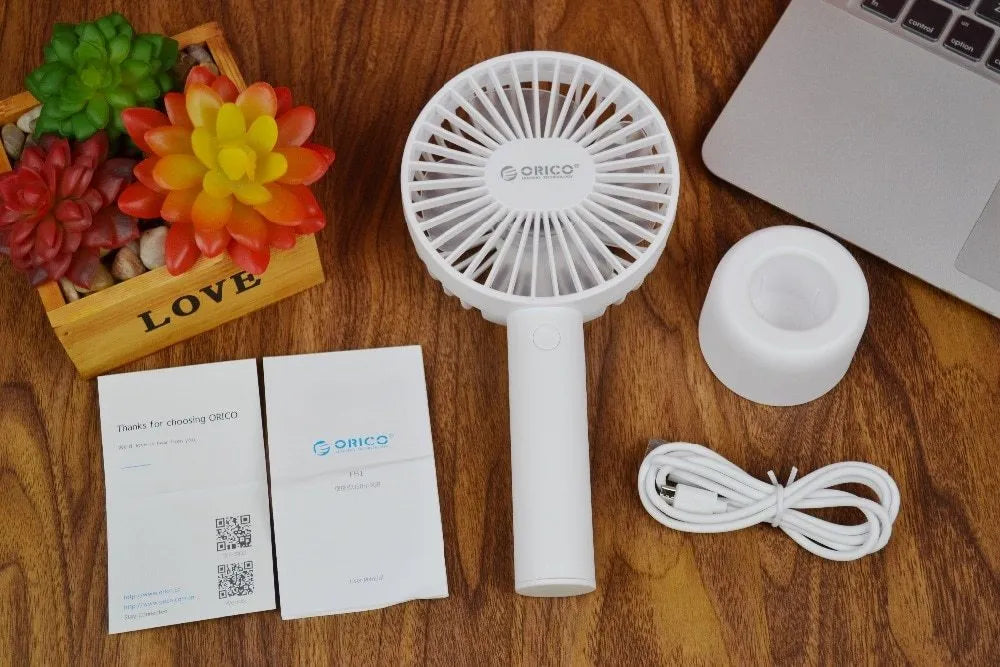 White ORICO FH1 USB rechargeable portable desktop fan with three-speed settings.