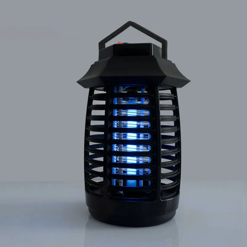 Black aromatherapy mosquito lamp with a choice of UV or LED tube on a table.