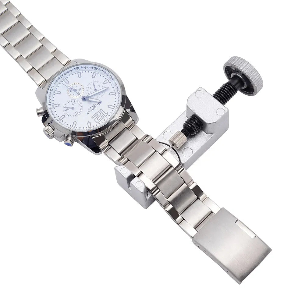 Silver metal watch strap adjuster tool with three spare needles for resizing steel bracelets